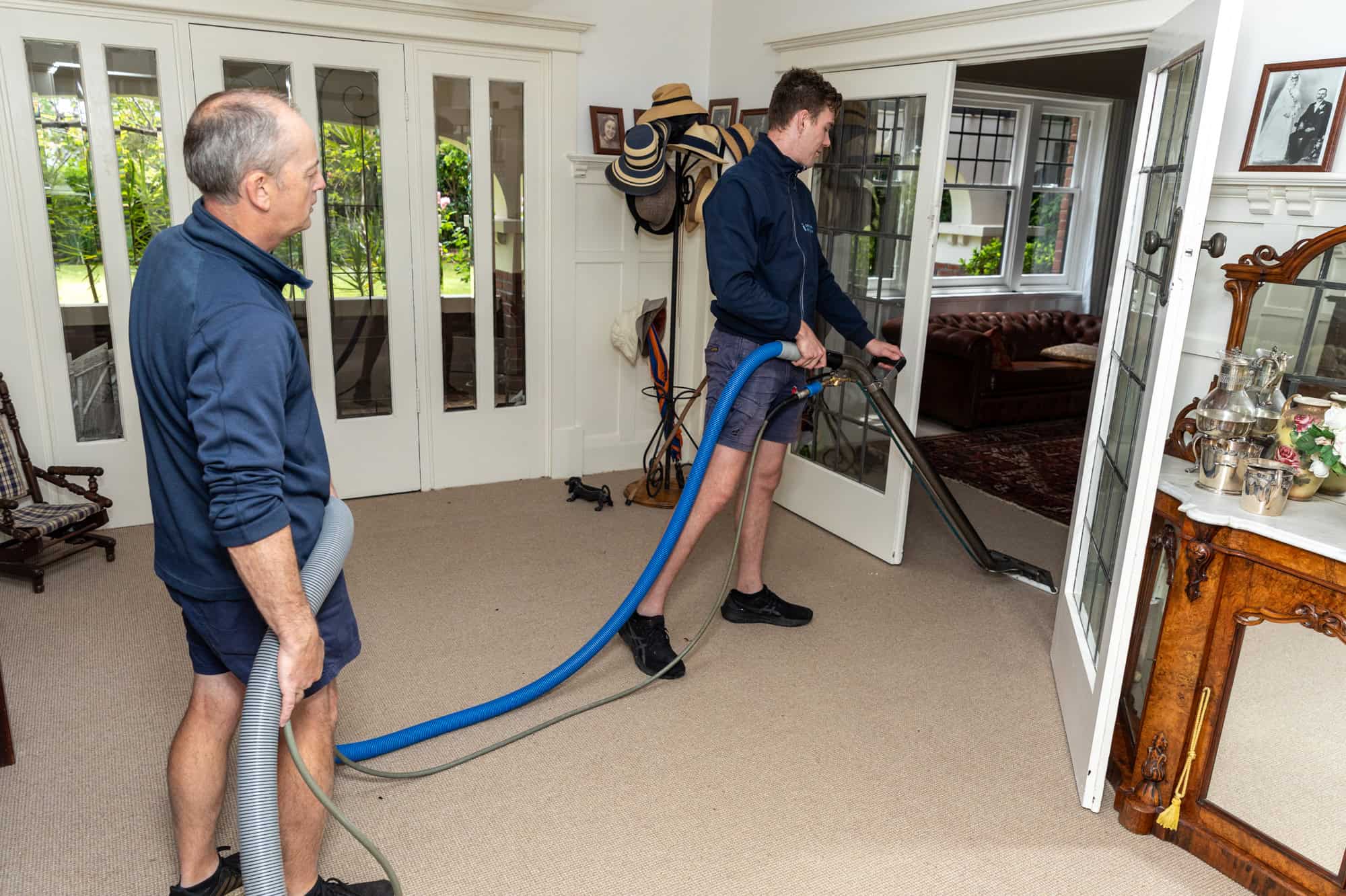 carpet cleaning lounge room, 2 workers Malvern