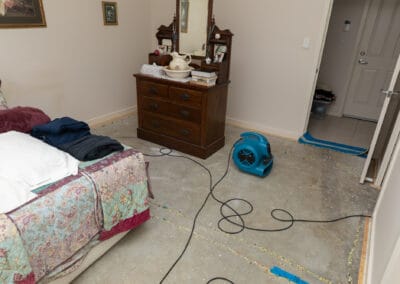 drying fans in a bedroom after the carpet is removed