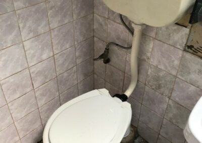 Bathroom tile cleaning near toilet after