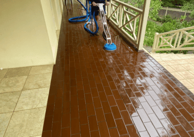 cleaning outdoor area with pressure washer