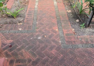 outdoor walkway, red bricks are dull and extremely dirty