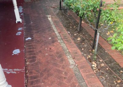 cleaning outdoor pavers, red bricks look dirty and dull