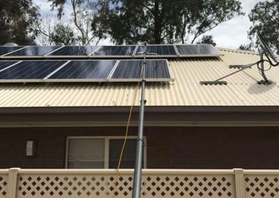 cleaning solar panels from over fence