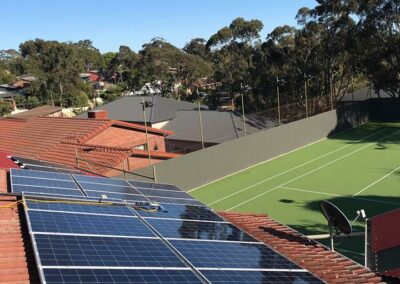 cleaning solar panels on tennis house