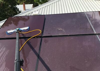 cleaning solar panels on roof