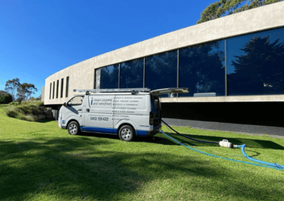 large modern house with large wall made of windows