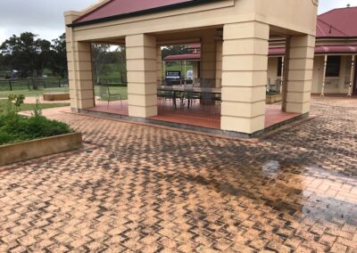 pressure cleaning pavers around outdoor area